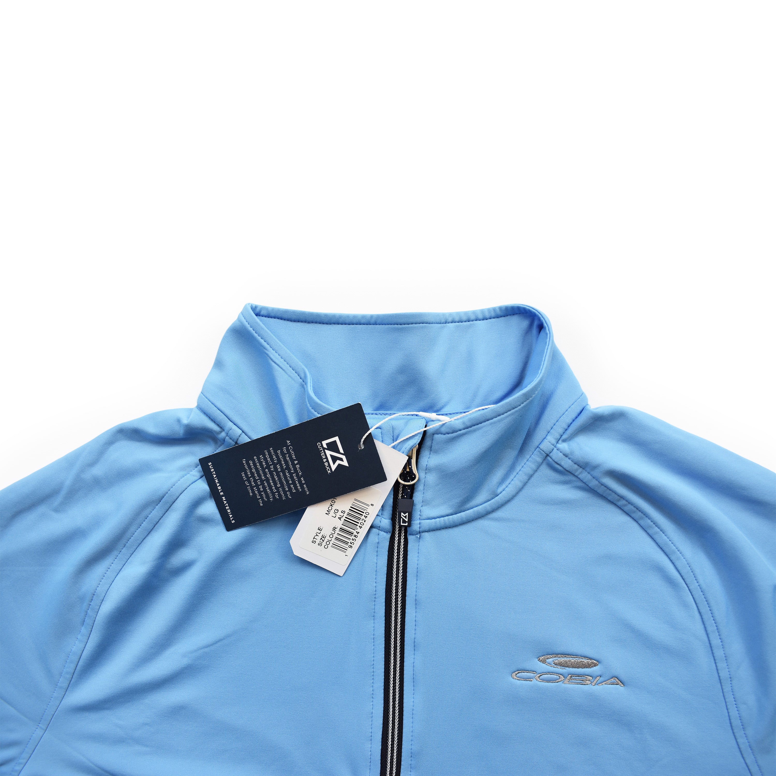Close up of a light blue quarter-zip with tags and the cobia logo embroidered in grey on the chest.