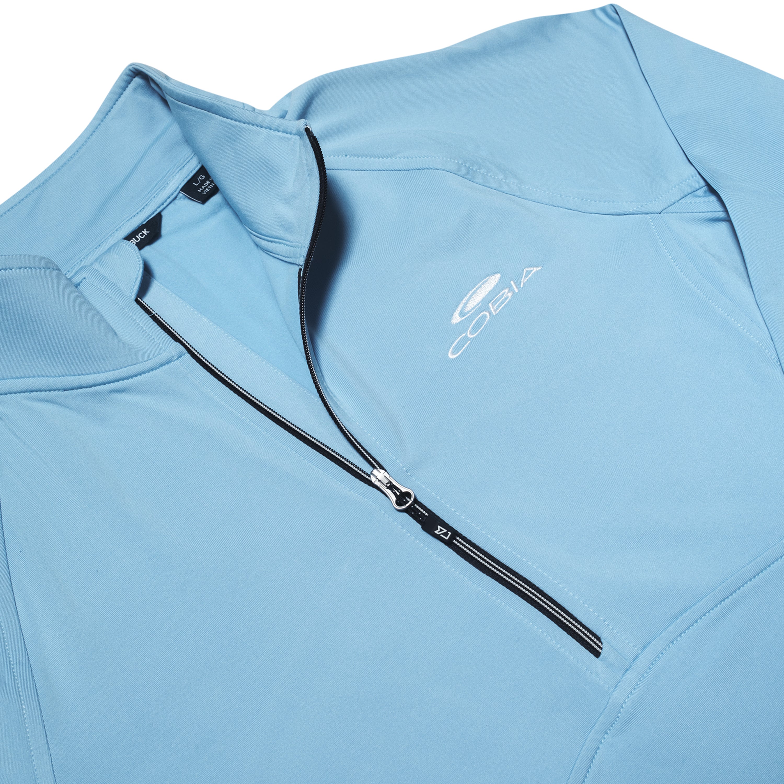 Light blue quarter-zip athletic shirt with a cobia logo on the chest.