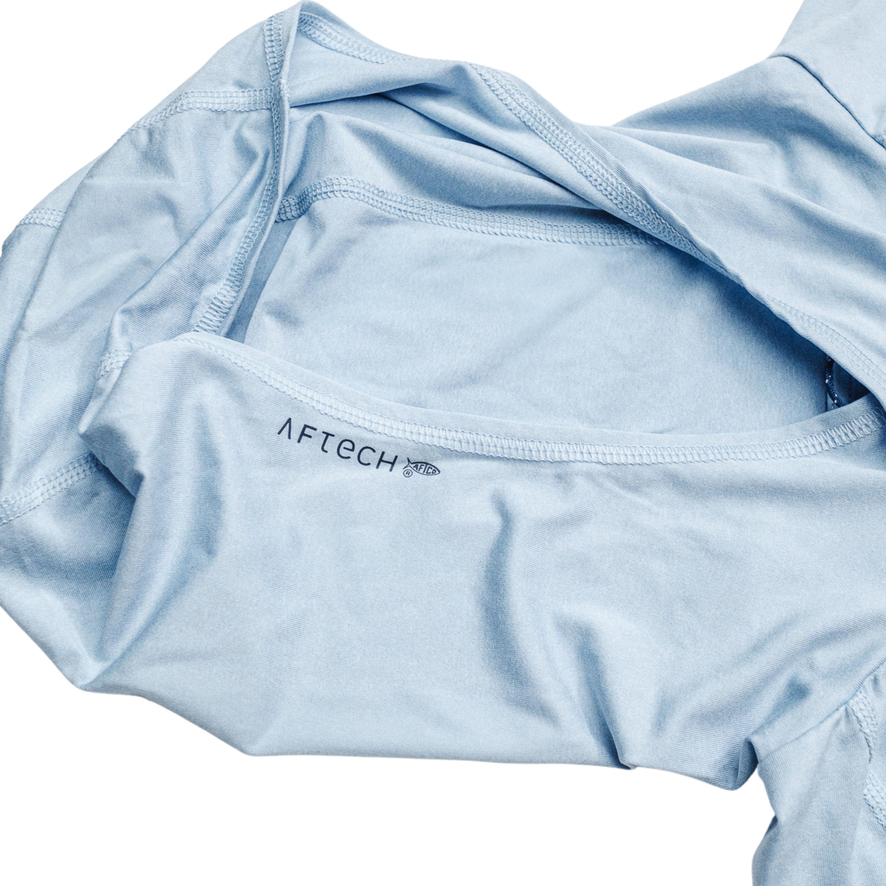 Close-up of a light blue hood on a shirt with a label reading 'AFTECH'.
