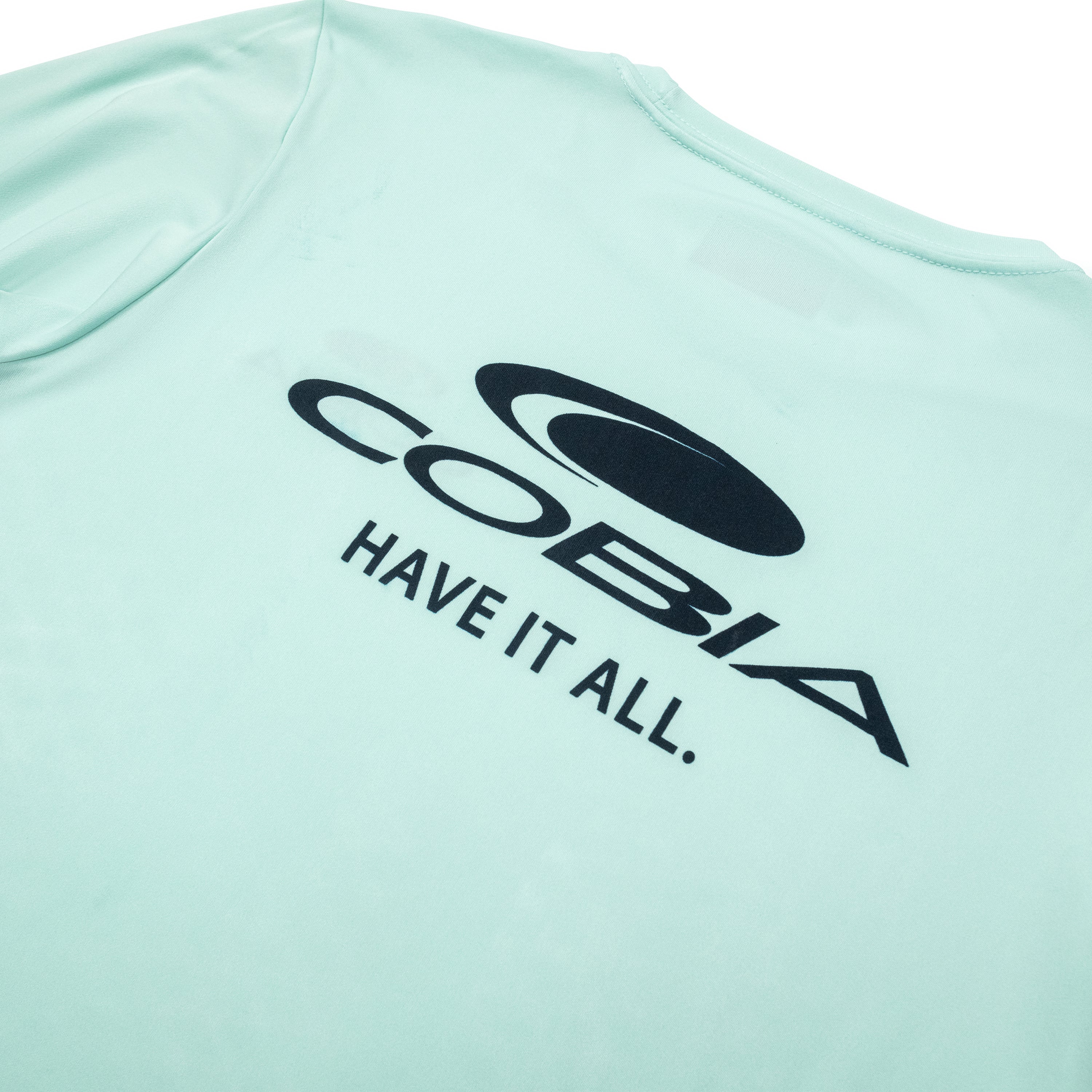 Mint green shirt featuring a black logo and text reading 'Cobia HAVE IT ALL.'