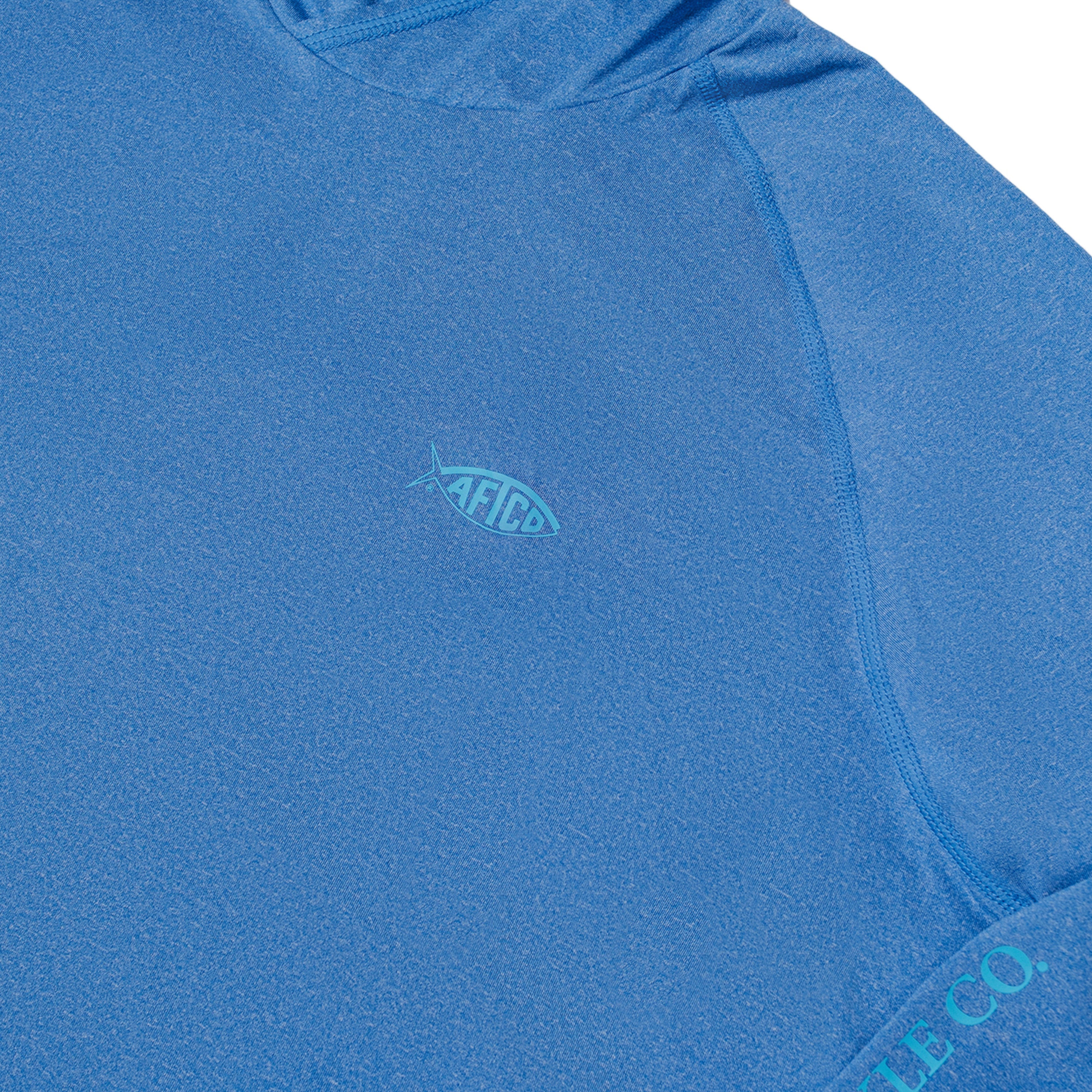 Close-up of a blue long sleeve featuring a small aftco logo.