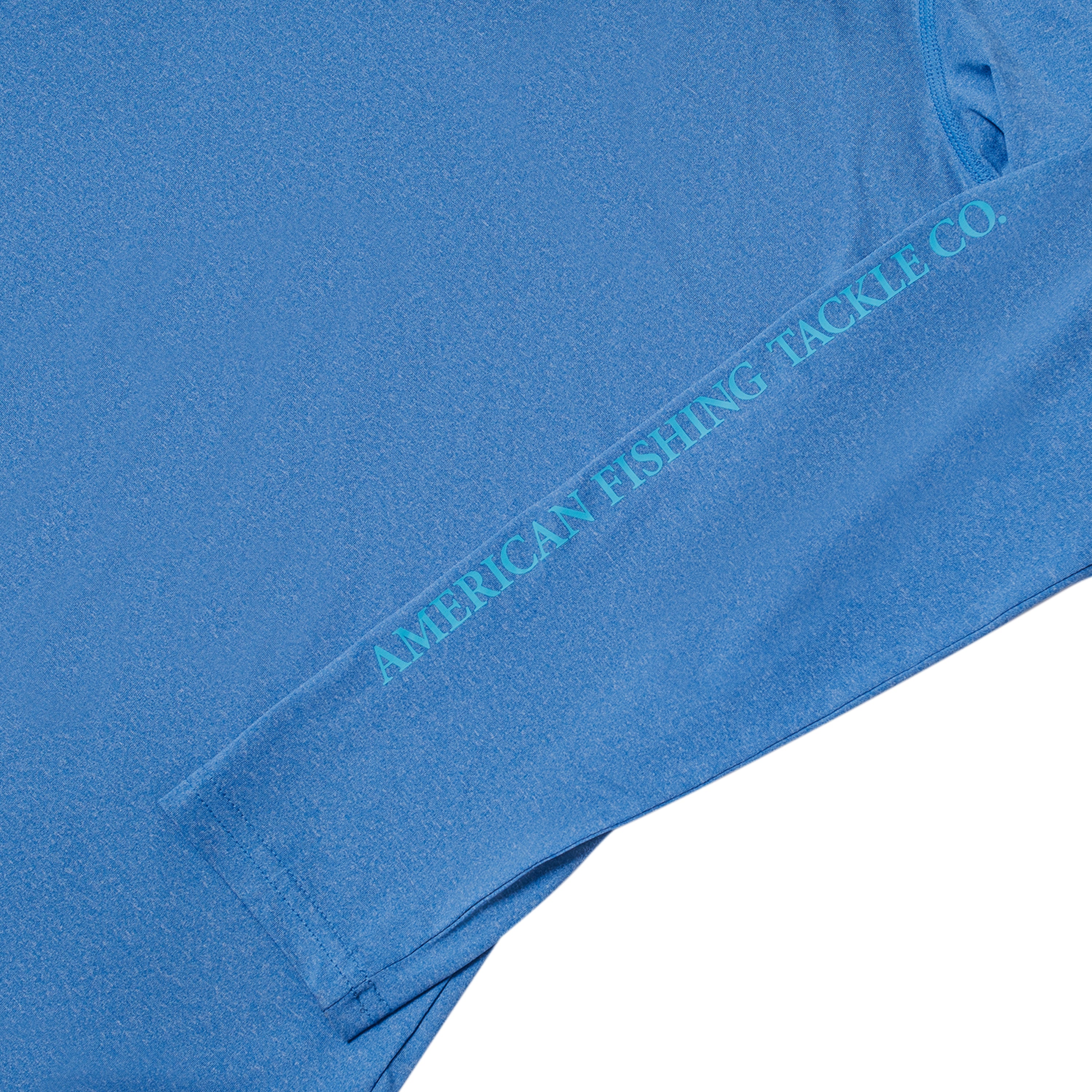 Close-up of a blue long-sleeve shirt featuring text that reads 'AMERICAN FISHING TACKLE CO.' down the sleeve.