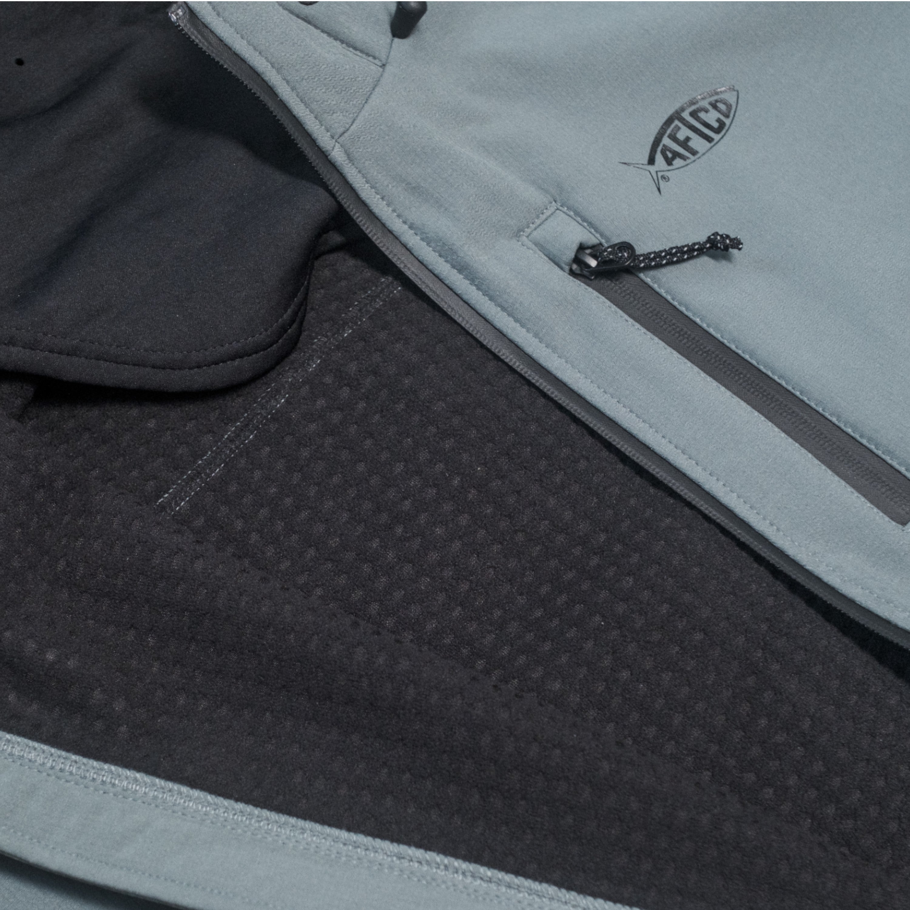 Close-up view of a grey jacket showing its black interior lining.