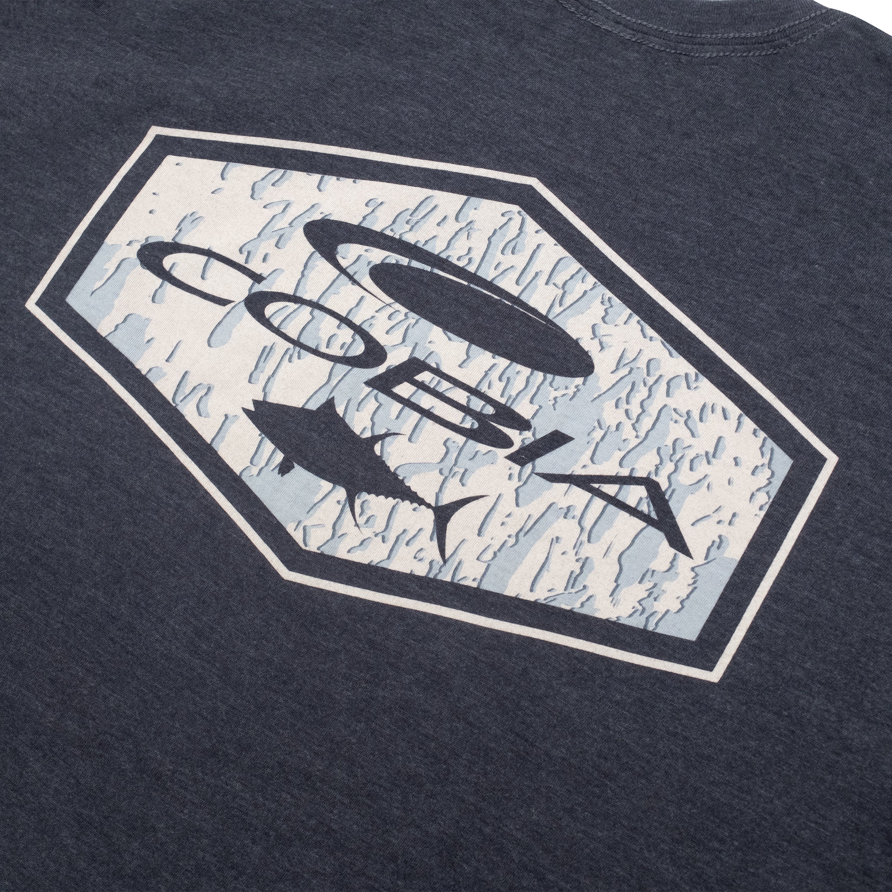 Graphic design featuring the word 'Cobia' and marine elements on a dark T-shirt.