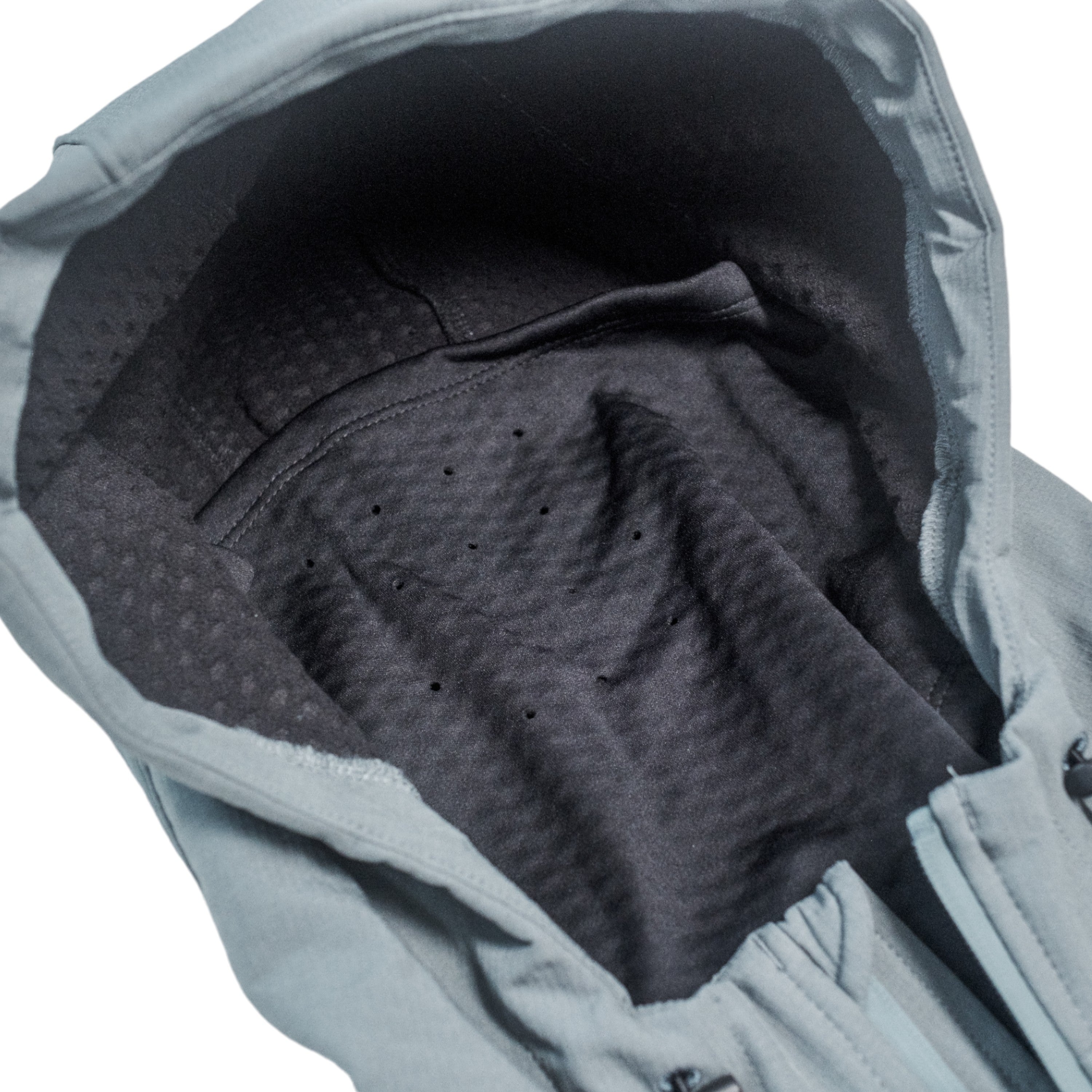 Interior view of a gray hooded jacket with a black textured lining and built-in face mask.