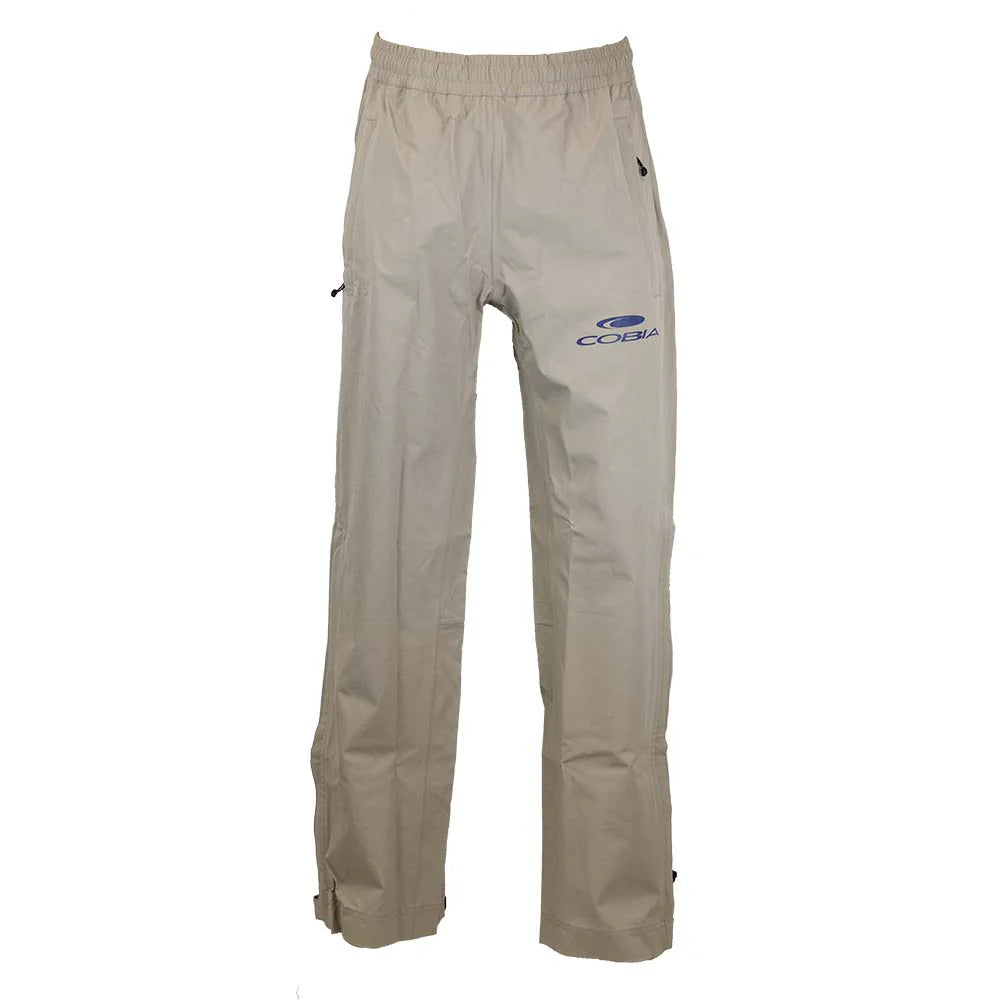 Khaki waterproof pants with an elastic waistband and side zippers, featuring the cobia logo in navy blue on the left hip. 