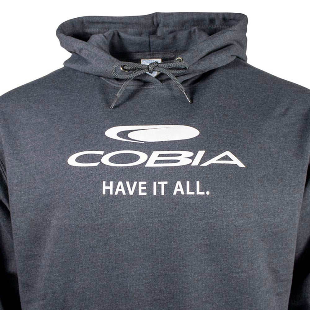 Close up of a dark grey hoodie with a white cobia logo on the chest. 
