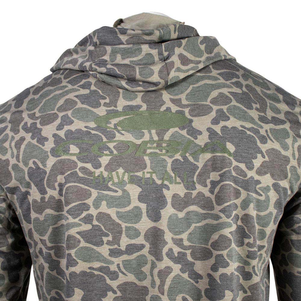 Close up of a green and brown camouflage-patterned long sleeve with a green cobia logo on it.