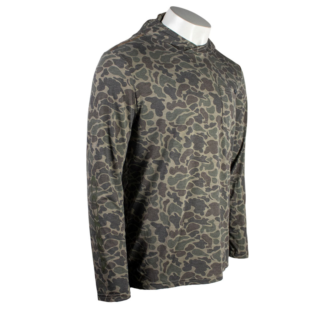 Side of a green and brown camouflage-patterned long sleeve with a green cobia logo on the right sleeve.