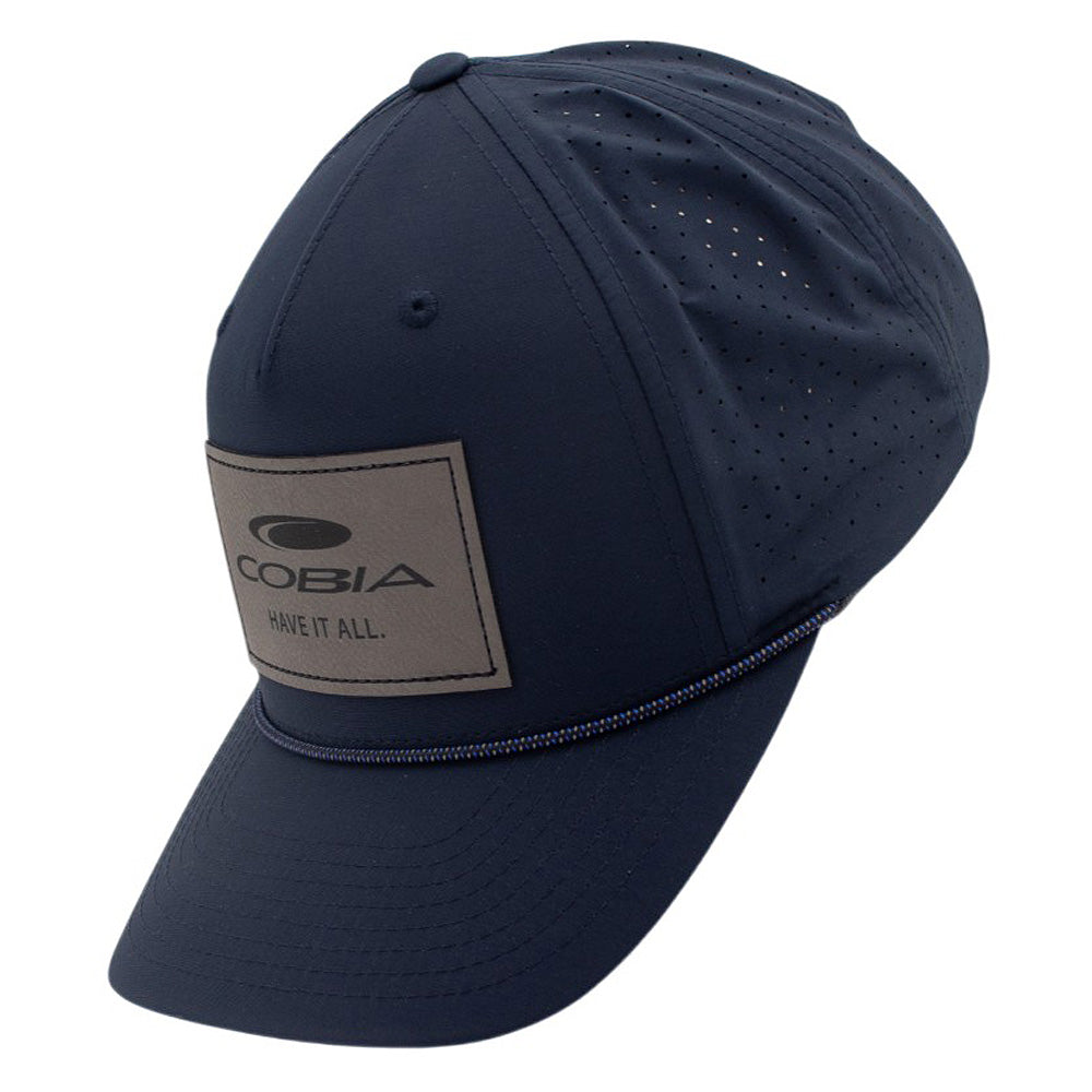 Side of a navy blue cap with a grey patch on the front and ventilated back panels.