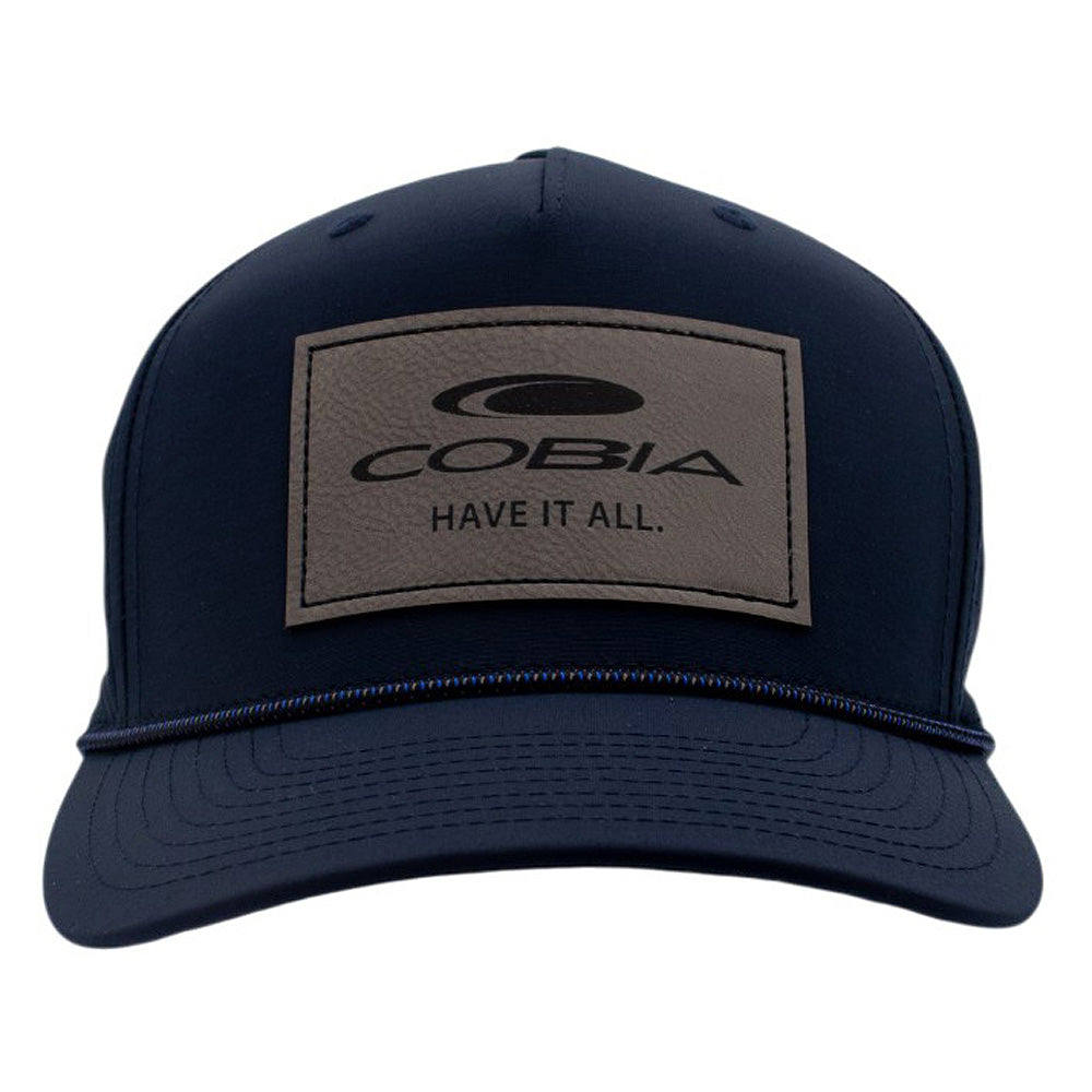 Navy blue cap with a grey logo patch on the front.