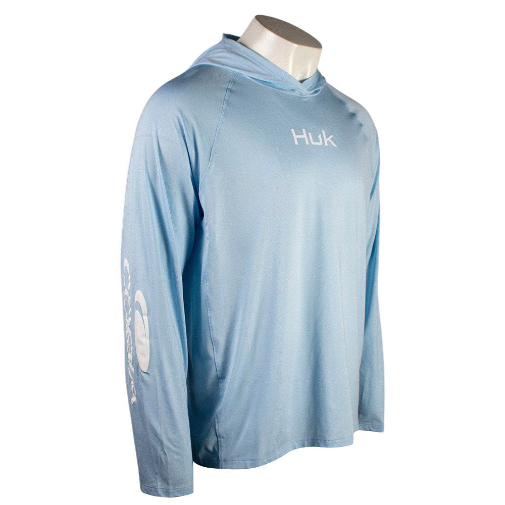 Side of a light blue hooded long sleeve with a white Cobia logo down the right sleeve.