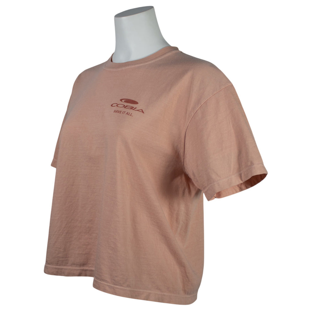 Side of a light orange t-shirt with a dark orange cobia logo on the left chest.
