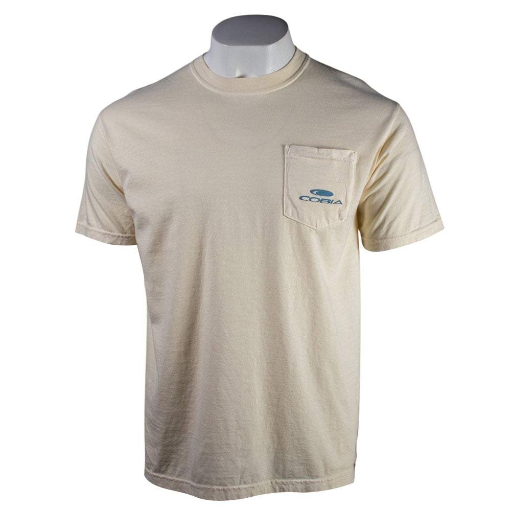 Cream colored t-shirt with a blue cobia logo on the left chest pocket.